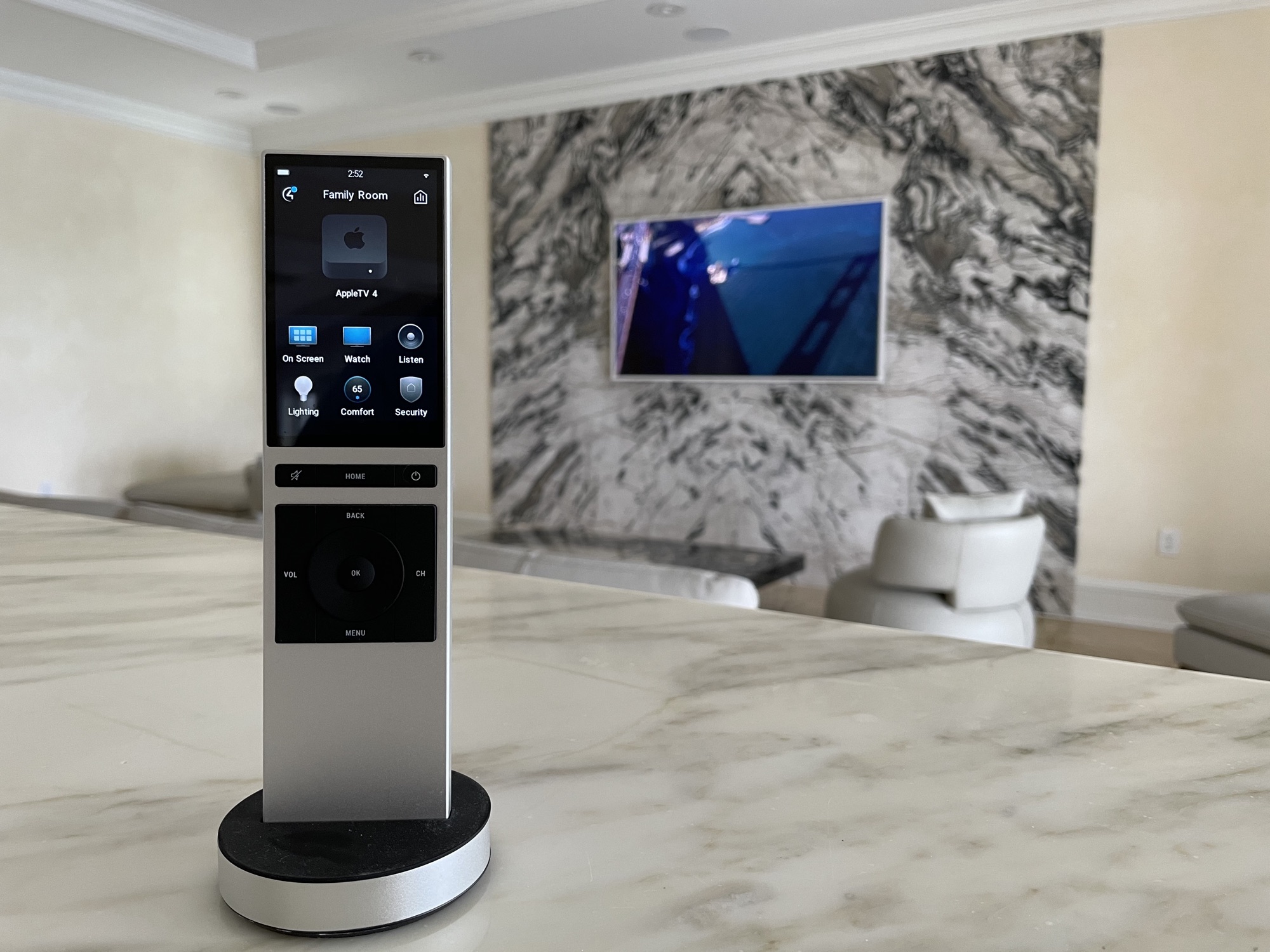 Single-touch system control on a marble counter in a luxury residence